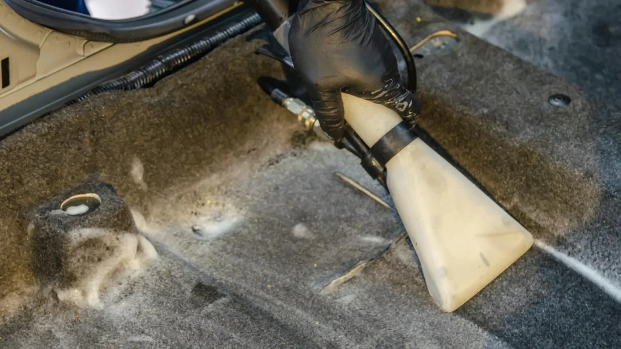 Common carpet spot cleaning mistake: scrubbing a red wine stain on a light-colored living room rug.