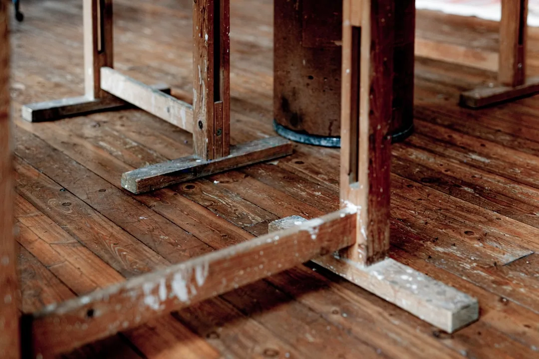 A Hand Cleaning Hardwood Floor