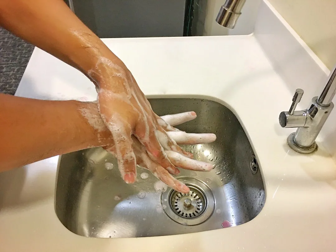 A Hand Buffing Surface Creating Mirror-like Streaks