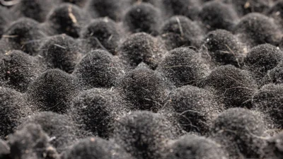 A close-up of a smelly, stained kitchen sponge next to a fresh, clean one, showing the contrast.