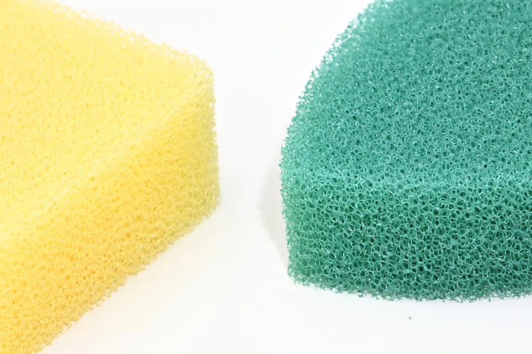 Dirty Kitchen Sponge Sits On A Countertop