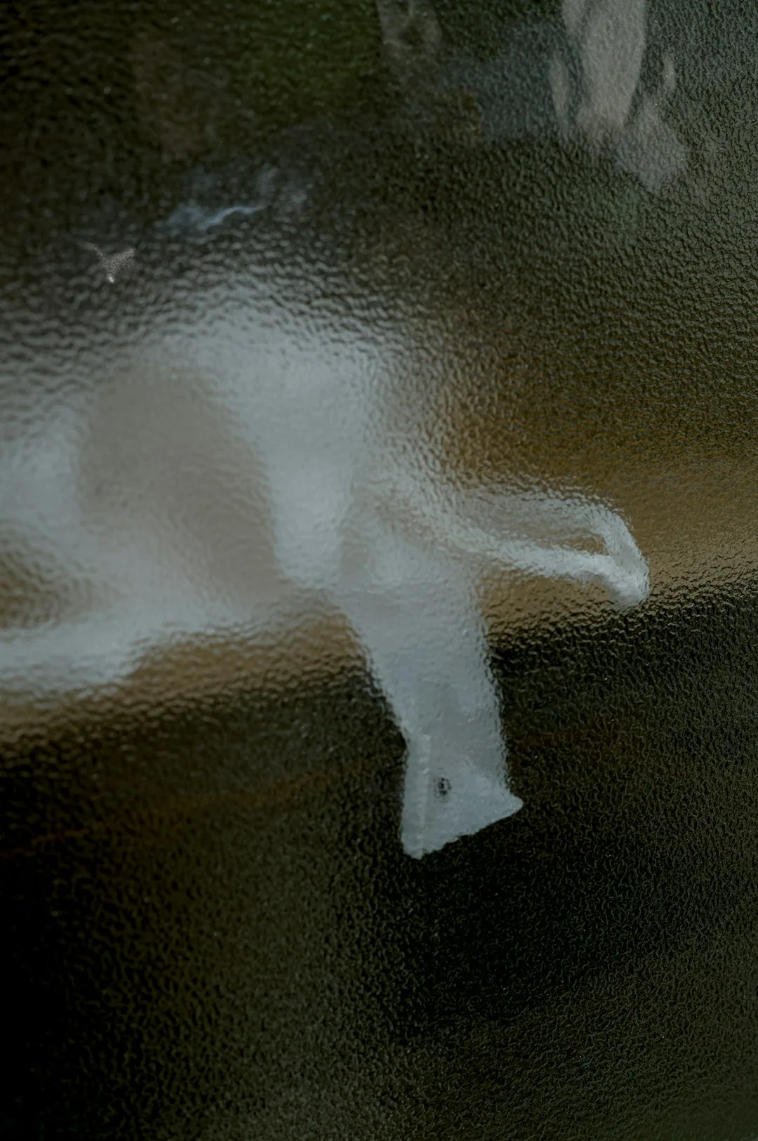 Person Using Spray Cleaner On A Surface With Cleaning Cloth