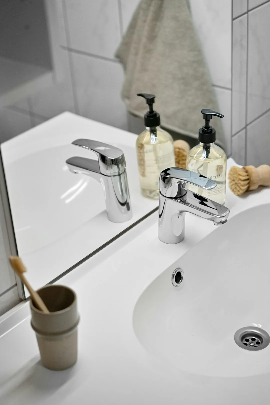 A Bathroom Sink Basin And Faucet With Cleaning Mistakes Highlighted