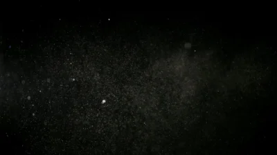 Person dusting a windowsill with a microfiber cloth to prevent dust from returning quickly.